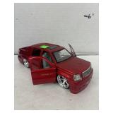 diecast model of a 2002 Cadillac Escalade