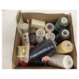 Box of embroidery and regular thread spools