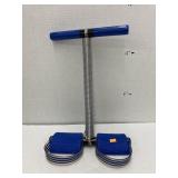 Spring tension foot pedal exerciser