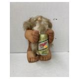 Stuffed male doll with beer can