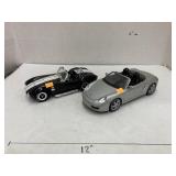 Shelby Cobra and Porsche Boxster