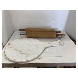 2 wooden rolling pins and decorative paddle board