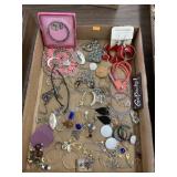 Necklaces, earrings, pins, bracelets, scissors