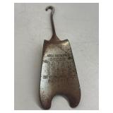 vintage metal shoe horn with an advertising
