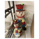 Metal snowmen figure and candle holder