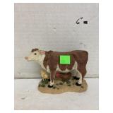 Resin cow and chickens figure