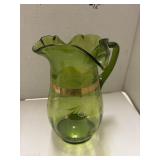 Victorian-style green glass pitcher