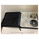 Binder of CDs, approximately 30