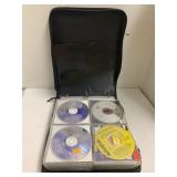 Binder of CDs, approximately 80