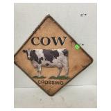 Metal cow crossing sign