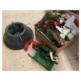 Box of Christmas tree stand and misc decor