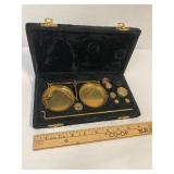 Vintage brass balance scale in velvet box