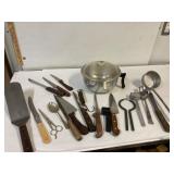 Antique pot and some utensils.