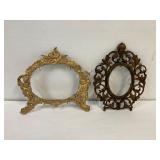 2 picture frames. stand up arms are missing