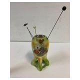 Porcelain hand painted hat pin holder.