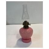 Pink glass miniature oil lamp.