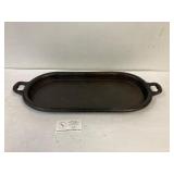 Oval cast iron griddle. 21 x 10'.Markings are gone