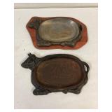 2 cast iron cow shaped sizzle plates.