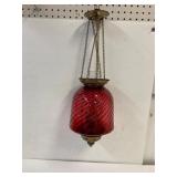 Cranberry swirl glass pull down oil lamp.