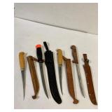4 filleting knives with sheaths.