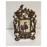 Brass ornate picture frame.