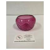 Cranberry glass candle holder.