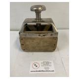 Industrial type butter press.