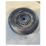 185 75 R 14 tire on rim.