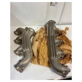 Exhaust manifolds for an 460 engine. Unused
