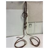Leather head stall and reins with snaffle bit