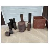 Wood stove with chimney and wood crate.