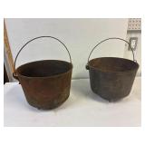 2 three footed cast iron pots. 11' across