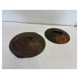 2 cast iron lids. 10' and 9' approximately