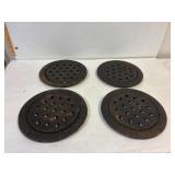 4 cast iron floor drain grates.