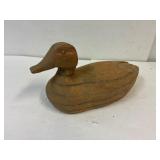 Wooden duck decoy. 14' long. Looks hand carved