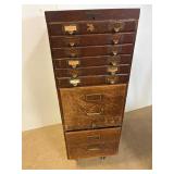 Antique wood filing cabinet.