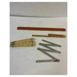 3 folding Rulers. One 18' wood ruler