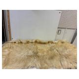 Hide or fur. Tanned. 27' x 59'