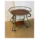 Decorative table on castors. 28 x 21 x 30' high