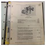 Binder of John Deere Parts Catalogs