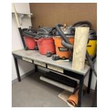 Table Lot of Shop Vacs and Contents