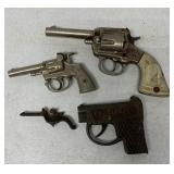 4 cast iron cap guns