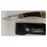 Buck 110 Louisiana Pacific knife in sheath