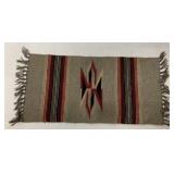small hand woven rug or placemat