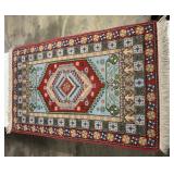 55 1/2"  x 32 1/2" oriental rug