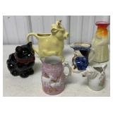 pitchers, creamers and a cat planter