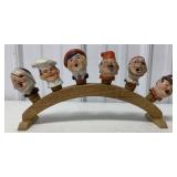 six bottle pourers on stand