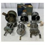 7 fishing reels, some damaged