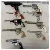 9 toy guns, not all working