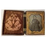 small daguerreotype of girl in gutta percha case